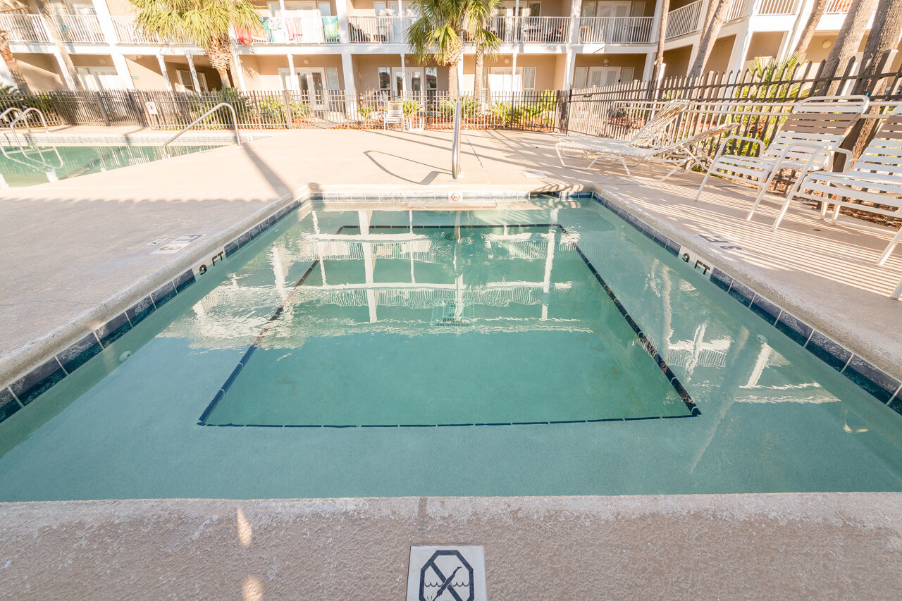 Relax in the outdoor spa at Grand Caribbean condos in Perdido Key